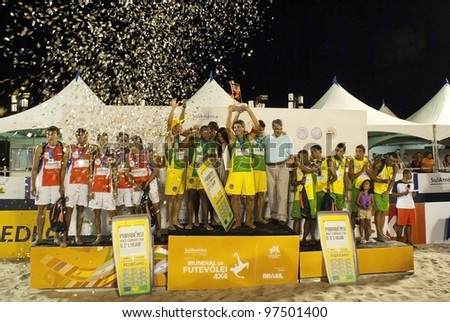 RIO DE JANEIRO - MARCH 10: podium with the three winners teams Paraguay team, Brazil 2 Team and Brazil 1 team at II World Cup of Futevalei Sulamerica 4x4 event March 10, 2012 in Rio de Janeiro,  Brazil
