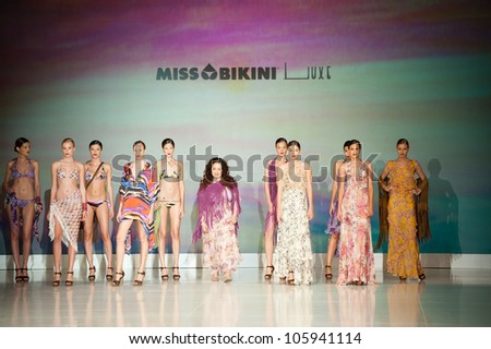 CANARY ISLANDS -JUNE 23: Designer Alessandra Piacentini (m) with unidentified models onstage in the Miss Bikini collection during Gran Canaria Moda Calida on June 23, 2012 in Canary Islands, Spain