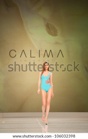 CANARY ISLANDS -JUNE 23: An unidentified model walks the runway in the Calima collection during Gran Canaria Moda Calida swimwear fashion show on June 23, 2012 in Canary Islands, Spain