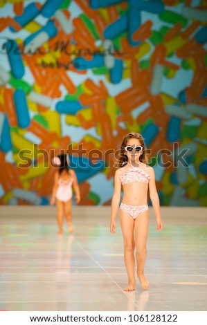 CANARY ISLANDS -JUNE 22: An unidentified model walks the runway in Delia Miranda Baby collection during Gran Canaria Moda Calida swimwear fashion show on June 22, 2012 in Canary Islands, Spain
