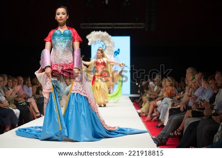 CANARY ISLANDS -26 SEPTEMBER: Unidentified model on the catwalk wearing carnival costume from designer Ma+Tino during Carnival Fashion World in Las Palmas September 26, 2014 in Canary Islands,Spain