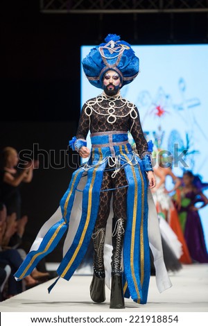 CANARY ISLANDS - 26 SEPTEMBER: Unidentified model on the catwalk wearing carnival costume from designer Beyo during Carnival Fashion World in Las Palmas September 26, 2014 in Canary Islands, Spain