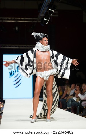 CANARY ISLANDS - 27 SEPTEMBER: Unidentified model on the catwalk wearing carnival costume from designer Ma + Tino during Carnival Fashion World in Las Palmas September 27, 2014 in Canary Islands,Spain