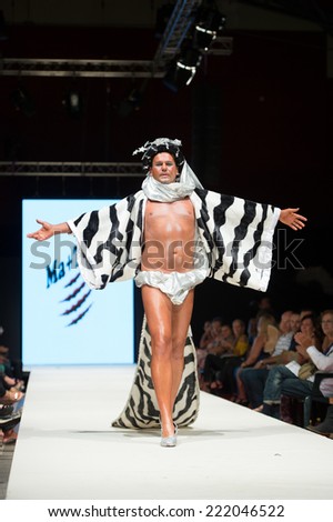 CANARY ISLANDS -27 SEPTEMBER: Unidentified model on the catwalk wearing carnival costume from Ma + Tino during Carnival Fashion World in Las Palmas September 27, 2014 in Canary Islands, Spain
