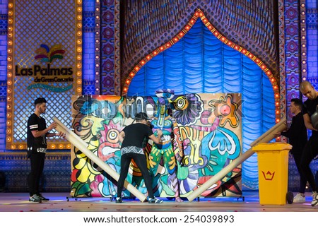 CANARY ISLAND, SPAIN - FEBRUARY 17, 2015: Anyelo Perez and unidentified assisters onstage during city of Las Palmas carnival One Thousand and One Nights Body Painting Contest.
