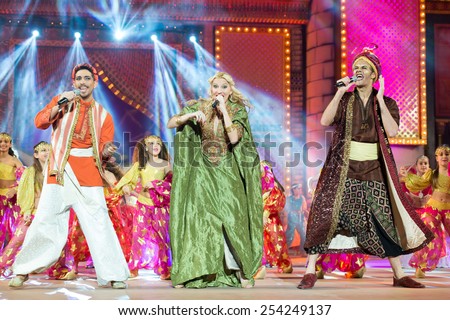 CANARY ISLAND, SPAIN - FEBRUARY 15, 2015:Television hosts Jose Carlos Campos (l), Alexia Rodriguez (m) and Victor Formoso (r) onstage during city of Las Palmas carnival Junior Queen Gala opening show.