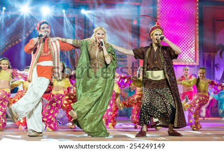 CANARY ISLAND, SPAIN - FEBRUARY 15, 2015:Television hosts Jose Carlos Campos (l), Alexia Rodriguez (m) and Victor Formoso (r) onstage during city of Las Palmas carnival Junior Queen Gala opening show.