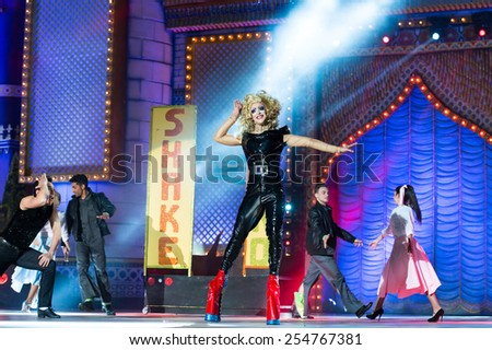 CANARY ISLAND, SPAIN - FEBRUARY 20, 2015: Drag Ikaro (m) as Olivia Newton John from the movie Grease and unidentified assistants with Grease costumes performing onstage during Drag Queen Gala.