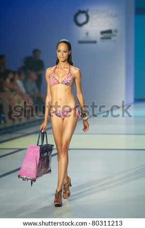 CANARY ISLANDS -JUNE 18: A model walks the runway in the Miss Bikini collection during Moda Calida in Maspalomas on June 18, 2011 in Canary Islands, Spain