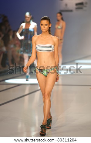 CANARY ISLANDS -JUNE 18: A model walks the runway in the Miss Bikini collection during Moda Calida in Maspalomas on June 18, 2011 in Canary Islands, Spain