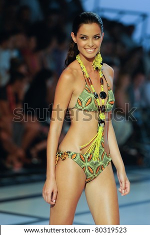 CANARY ISLANDS -JUNE 18: A model walks the runway in the Adama Paris collection during Moda Calida in Maspalomas June 18, 2011 in Canary Islands, Spain
