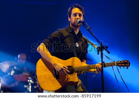 CANARY ISLANDS - SEPTEMBER 30: Guitarist and singer Victor Ordonez from the band The Good Company during Heineken Music Fest September 30, 2011 in Las Palmas, Canary Islands, Spain