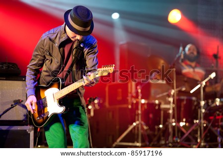 CANARY ISLANDS - SEPTEMBER 30: Guitarist Alby Ramirez from the band The Good Company during Heineken Music Fest September 30, 2011 in Las Palmas, Canary Islands, Spain