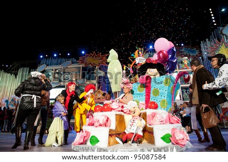 LAS PALMAS, SPAIN- FEBRUARY 12: First prize to Aymara del Pino Rueda, from Canary Islands, onstage  surrounded with unidentified people  during The Junior Queen on February 12, 2012 in Las Palmas,Spain