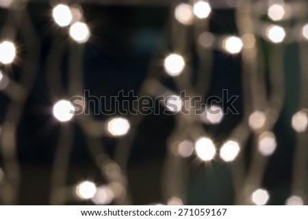 Beautiful defocused LED lights filtered bokeh abstract with warm tone background.