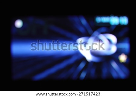 Beautiful defocused dvd player filtered bokeh abstract with blue tone background.