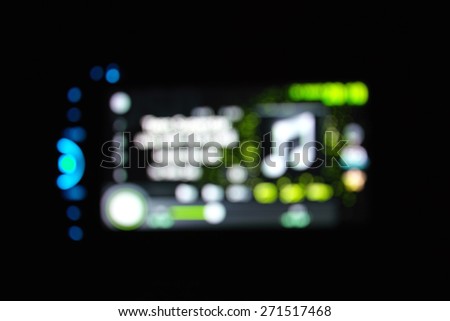 Beautiful defocused dvd player filtered bokeh abstract with green tone background.