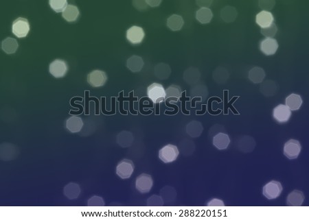 Beautiful defocused LED lights filtered bokeh abstract with green blue tone background.
