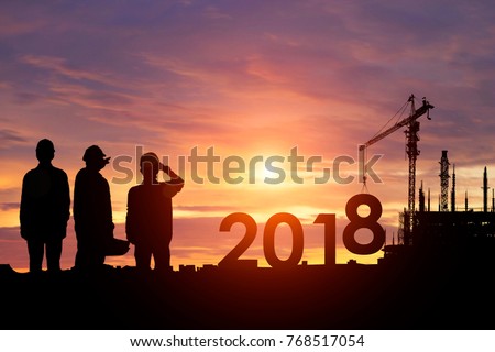 Silhouette workers work constructively to create. 2018 New Year