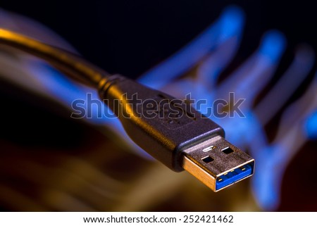 USB connector on the background of glowing neon lines