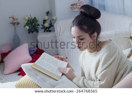 young woman leafing through favorite book