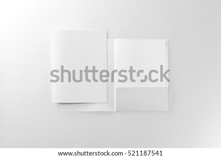 Corporate stationery set mockup. Two presentation folders and letterhead at white textured paper background.