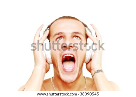stock photo Young DJ with tattoos on arms screaming while his music pushes