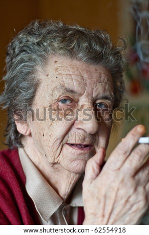 portrait of a old lady smoking a cigar