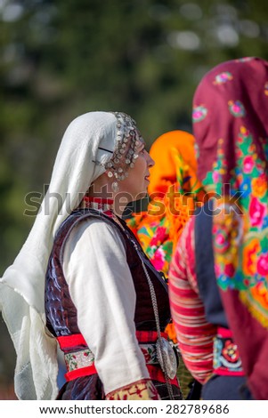 RAZLOG, BULGARIA - APRIL 13, 2015: Female Bulgarian folklore dancers during the traditional folklore festival \