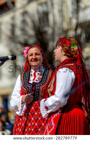 RAZLOG, BULGARIA - APRIL 13, 2015: Two female Bulgarian folklore singers during the traditional folklore festival \