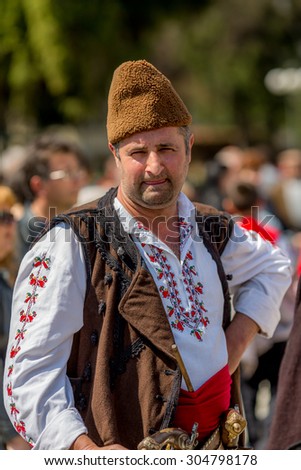RAZLOG, BULGARIA - APRIL 13, 2015: Bulgarian folklore dancer posing during the traditional folklore festival \
