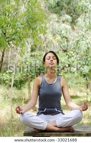 young woman in green forest, yoga and meditation
