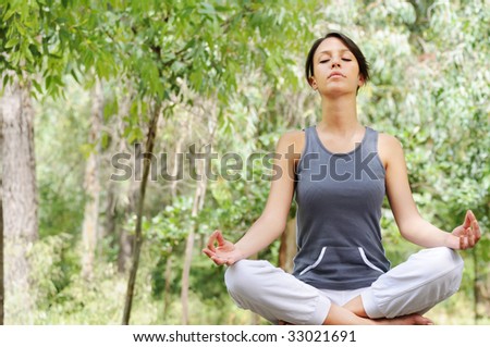 young woman in green forest, yoga and meditation