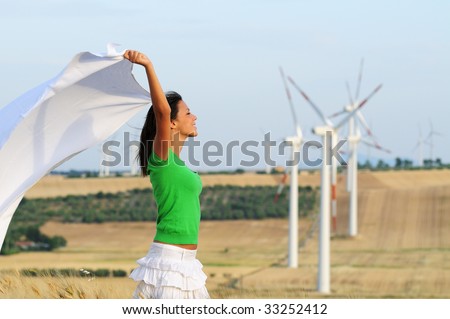 woman and wind, electronic power and alternative energy between turbines and windmill