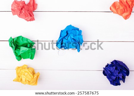 Colorful crumpled paper on a white background. Colored paper balls