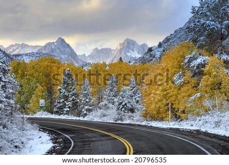 Empty Mountain Road in the Sierra Mountains after an early snow in the Fall