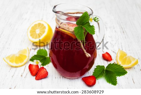 Strawberry drink with fresh strawberries on a wooden background