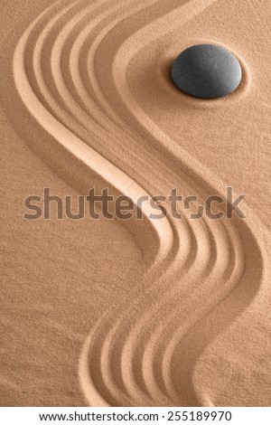 zen background meditation stone and pattern of lines in sand harmony relaxation and spirituality for spa wellness or yoga