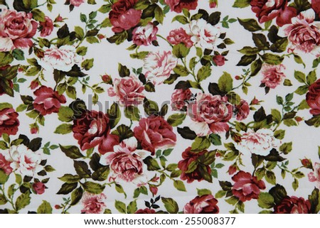 White cotton fabric in vintage roses pattern for background or texture
