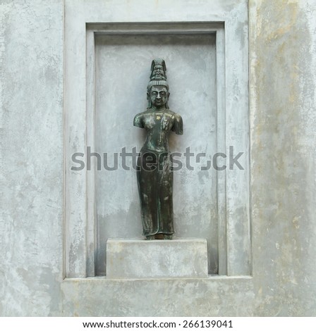 Buddha statues with plaster background