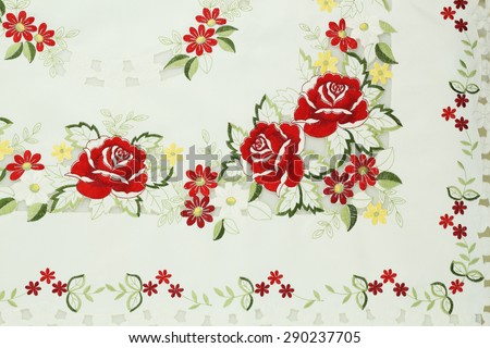 White cotton fabric in embroidery roses pattern for background or texture