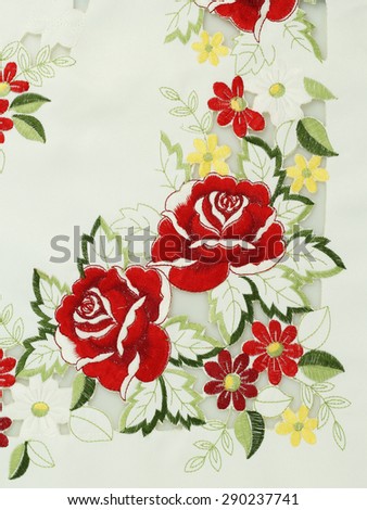 White cotton fabric in embroidery roses pattern for background or texture