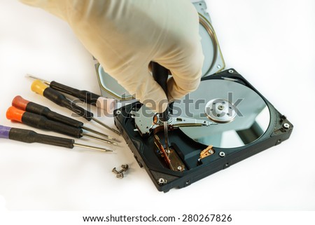 open hard disk drive by screwdriver, repairing data storage device