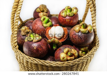 fresh mangosteen fruit in handicraft basket, Thai fruit