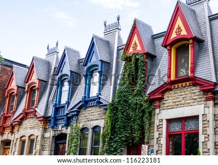 Part of Victorian houses facade, seen from the west side with the color of the roof in Montreal