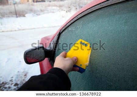 Frozen car window during winter morning