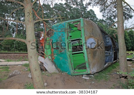 Fatal train crash. Derailed locomotive laying in the woods