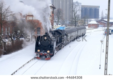 Old retro steam train stopped at the station