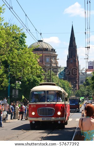 POZNAN - JUNE 26: 130th anniversary public transportation with a solemn parade of the vehicles. Buses and tramways in a cue from the oldest to the newest on June 26, 2010 in Poznan, Poland