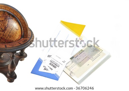 Old wood globe, passport and air ticket with baggage check isolated over white. Travel concept.